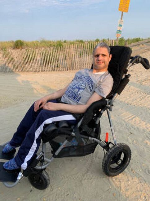 Matthew D'Annunzio in his new chair on the beach.