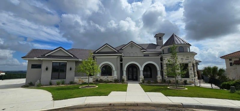 Large stone mansion with arched entryways