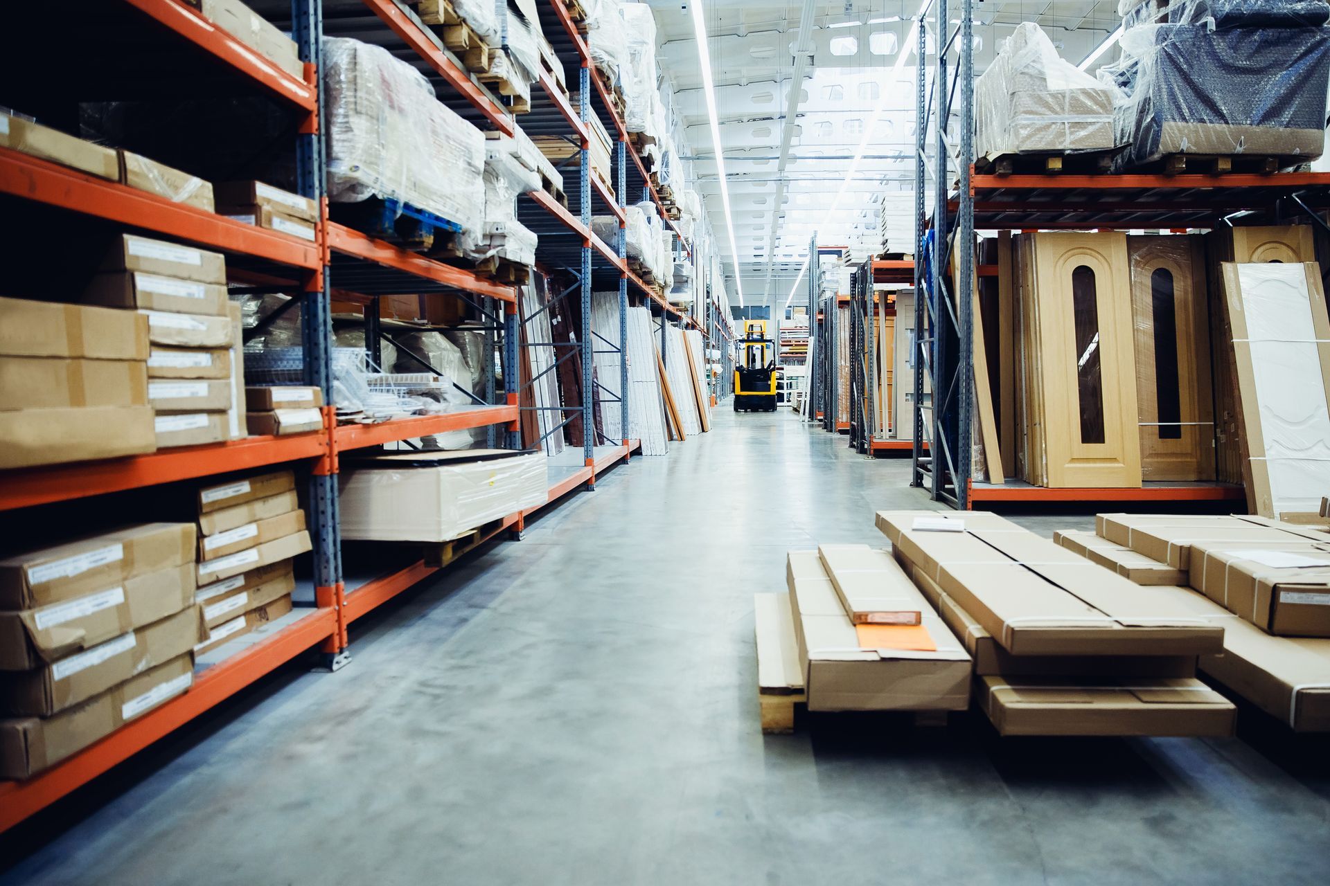 A warehouse filled with lots of boxes and shelves.