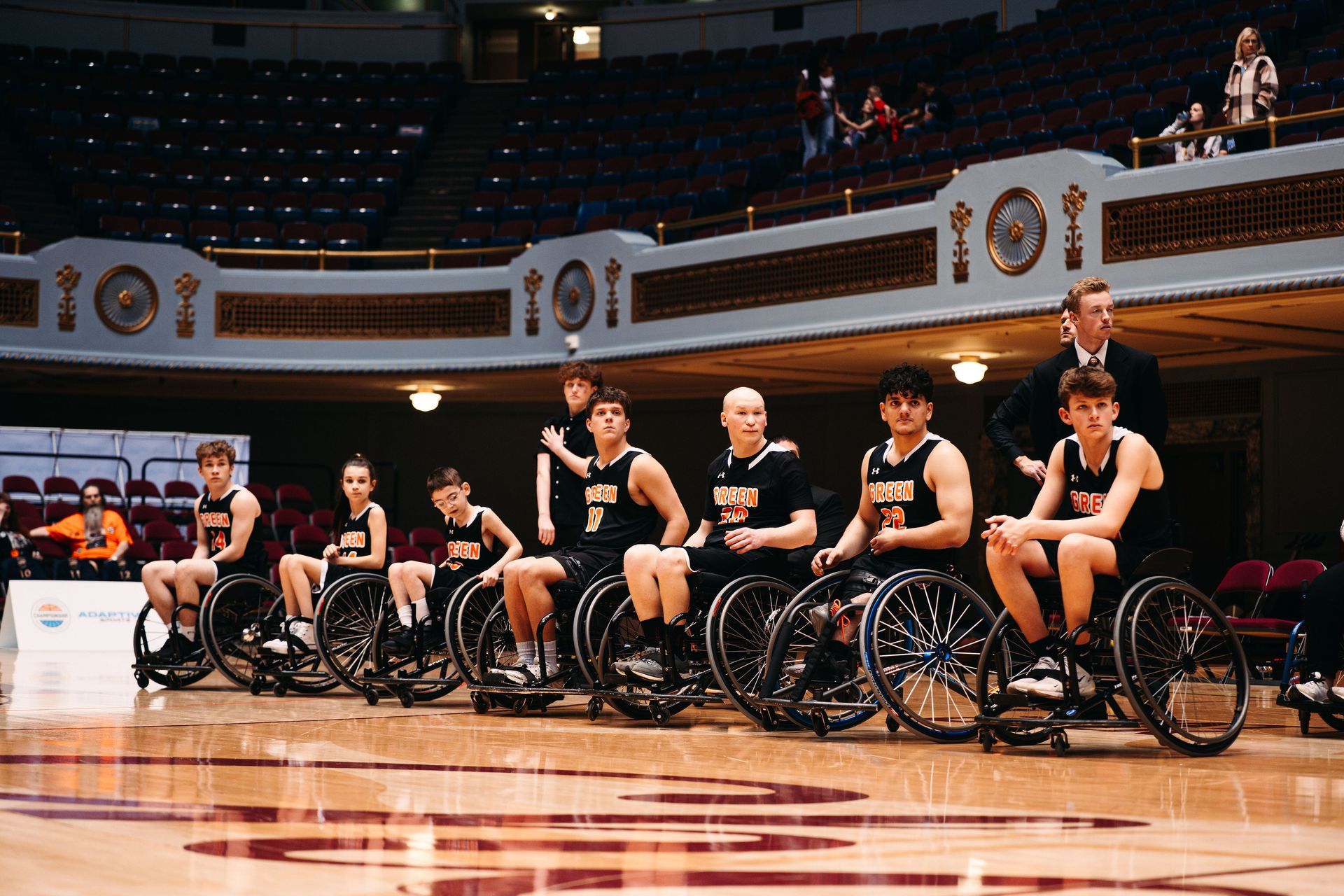 Green wheelchair basketball team.