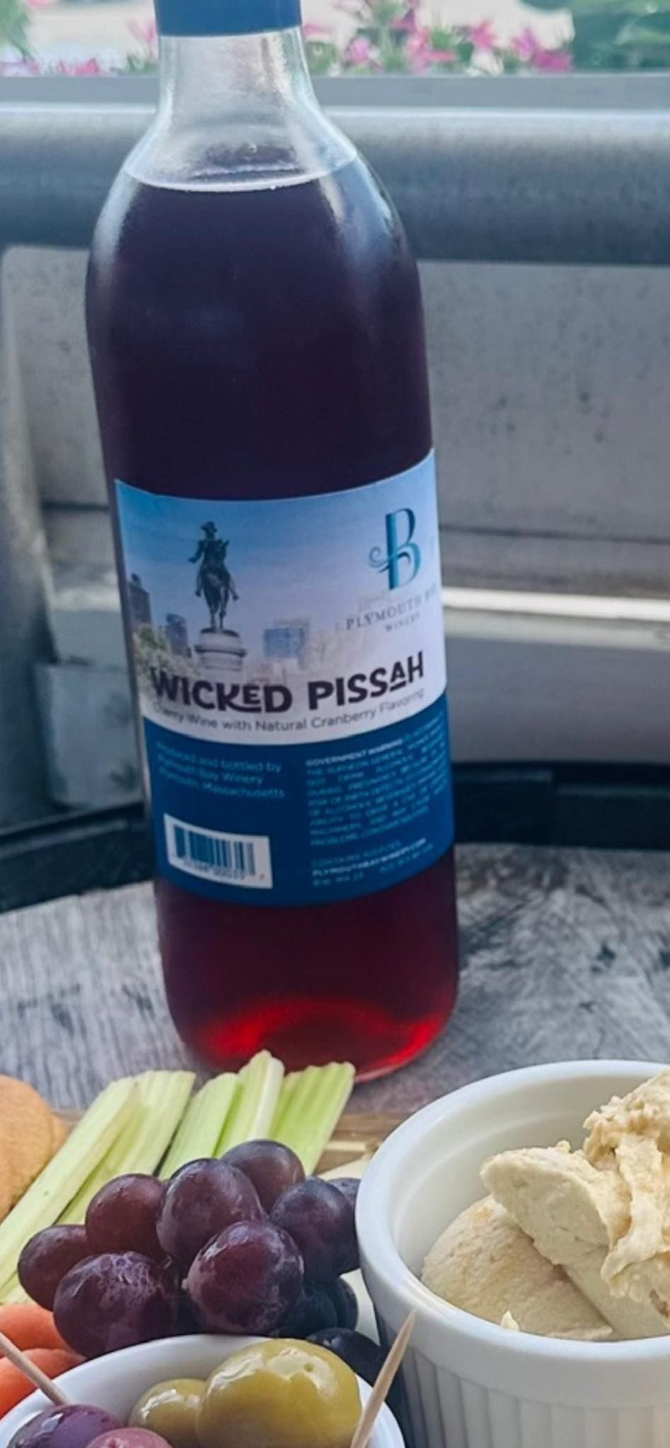 Bottle of red liquid labeled 