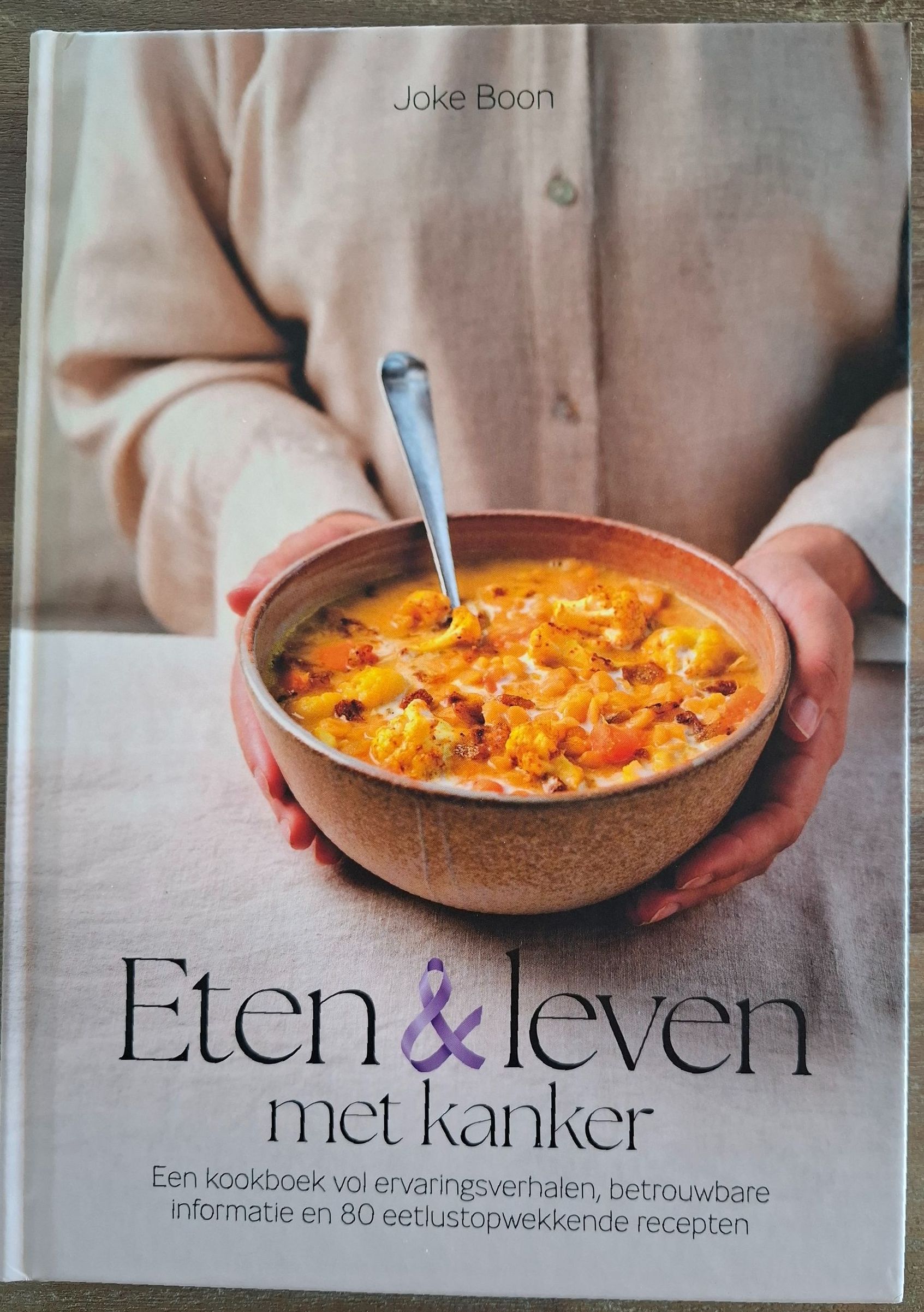 Book cover: Person holding a bowl of soup, title