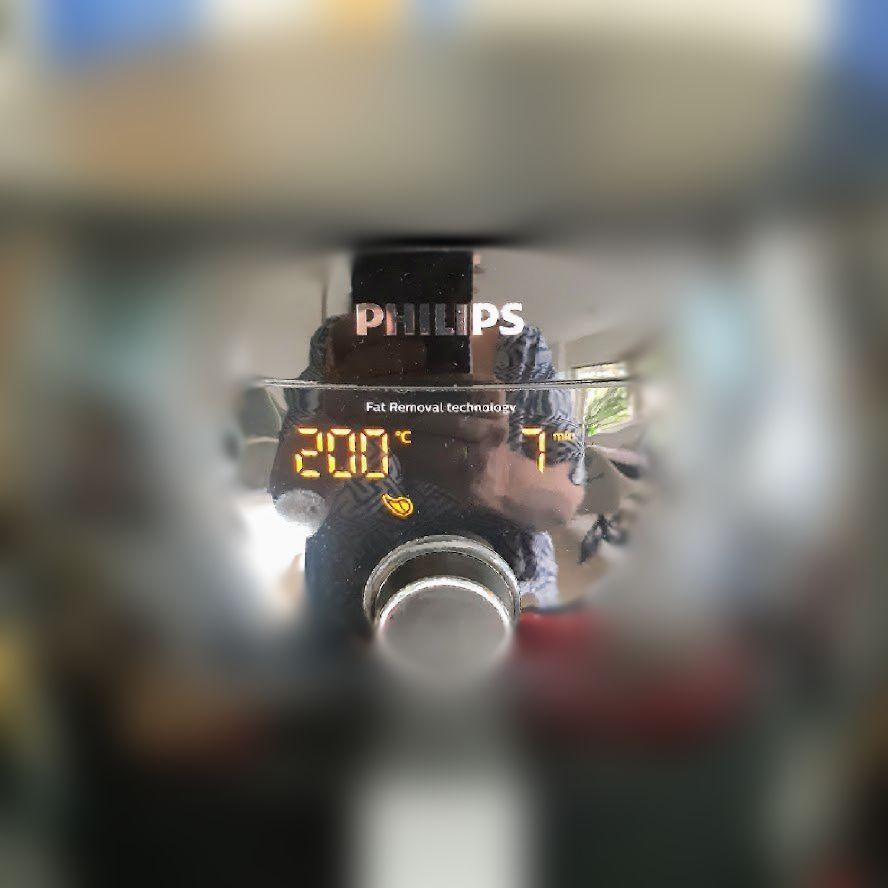 Digitaal display van een Philips airfryer met een temperatuur van 200°C.