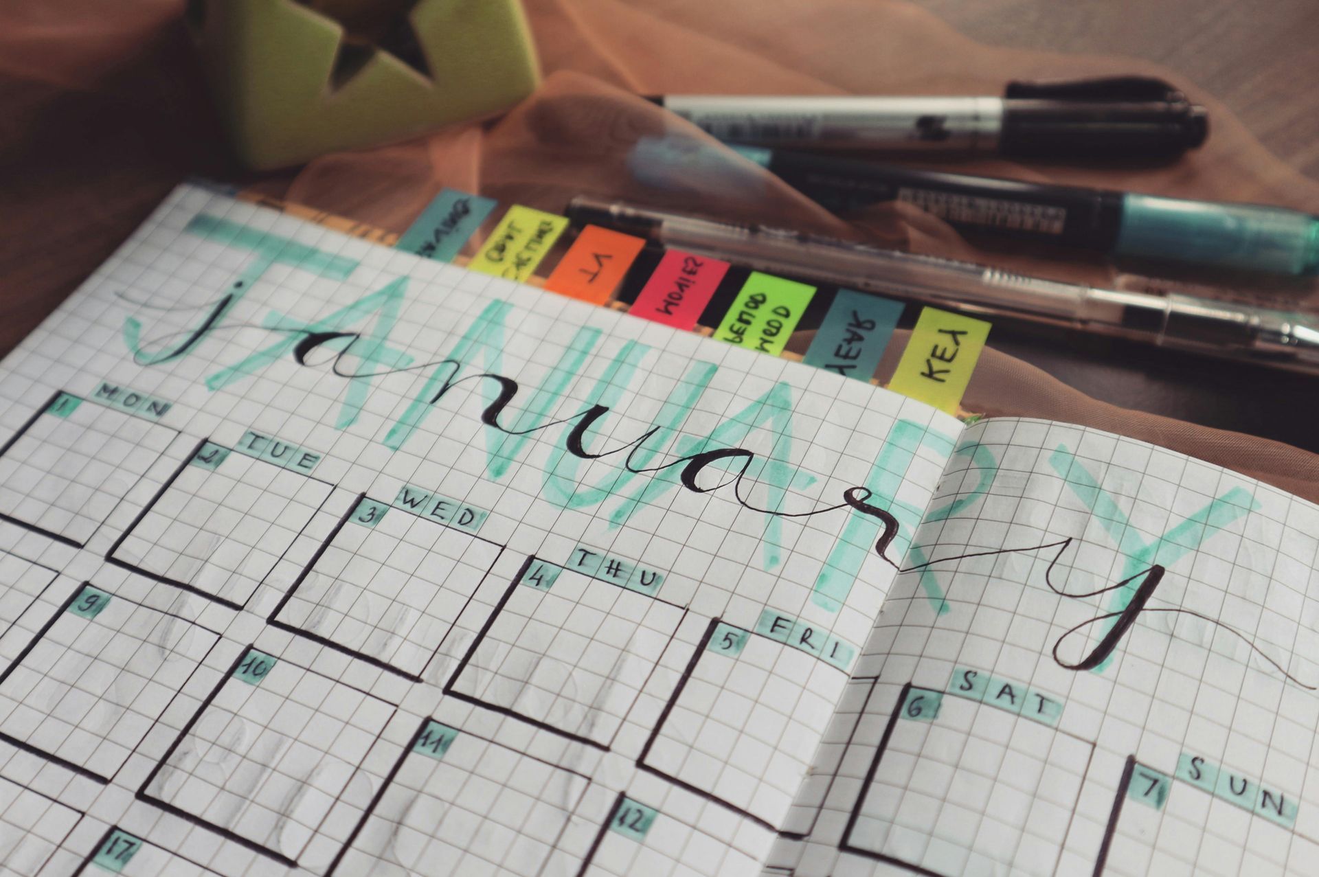 Een bullet journal met een turquoise