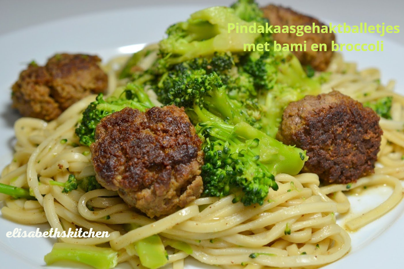 Plate of pasta with broccoli and meatballs, text 