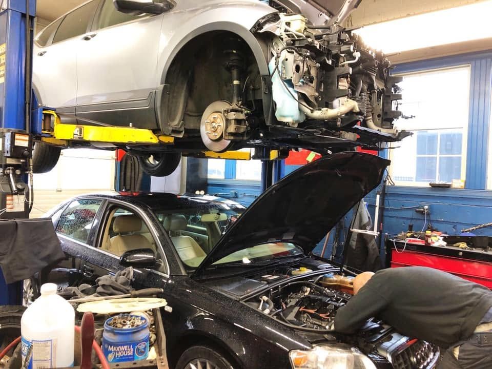 Multiple Vehicles Being Serviced Inside An Auto Repair Shop | Elmwood Certified Powered by Ampro Auto