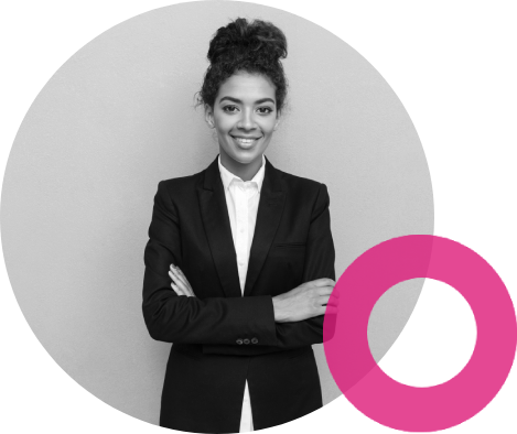 Woman in a suit, arms crossed, smiling.
