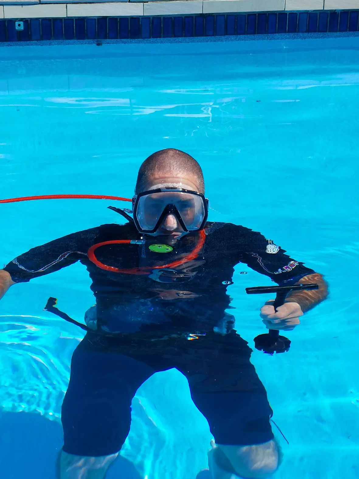 Man in Scuba Gear in a Pool, Facing the Camera — Ballina Leak Detection & Swimming Pool Repairs in Ballina, NSW