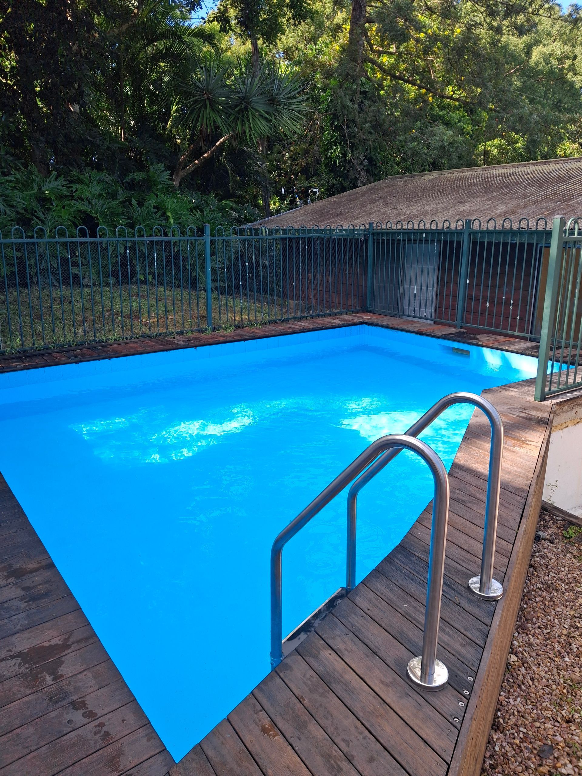 A Rectangular Swimming Pool Filled With Bright Blue Water — Ballina Leak Detection & Swimming Pool Repairs in Ballina, NSW