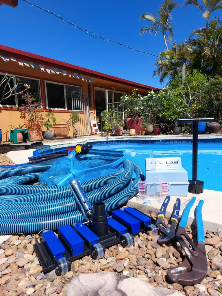 Pool Cleaning Equipment Laid Out by a Poo — Ballina Leak Detection & Swimming Pool Repairs in Ballina, NSW