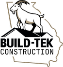 The logo for build-tek construction shows a goat standing on top of a roof.