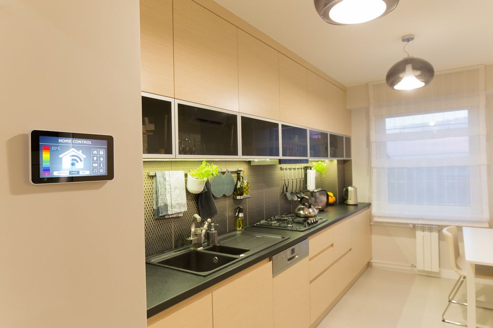 A Kitchen With a Sink, Stove, and a Thermostat on the Wall — Adept Security Kiama, NSW