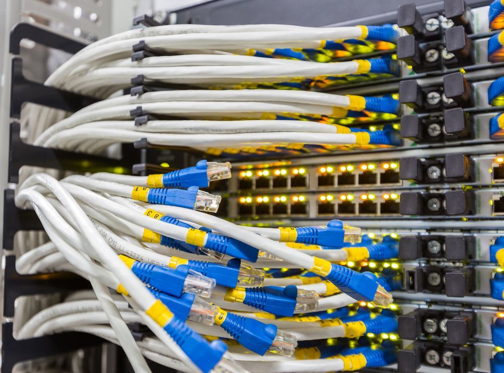 A Bunch of Wires Are Connected to a Server in a Data Center — Adept Security In Oak Flats, NSW
