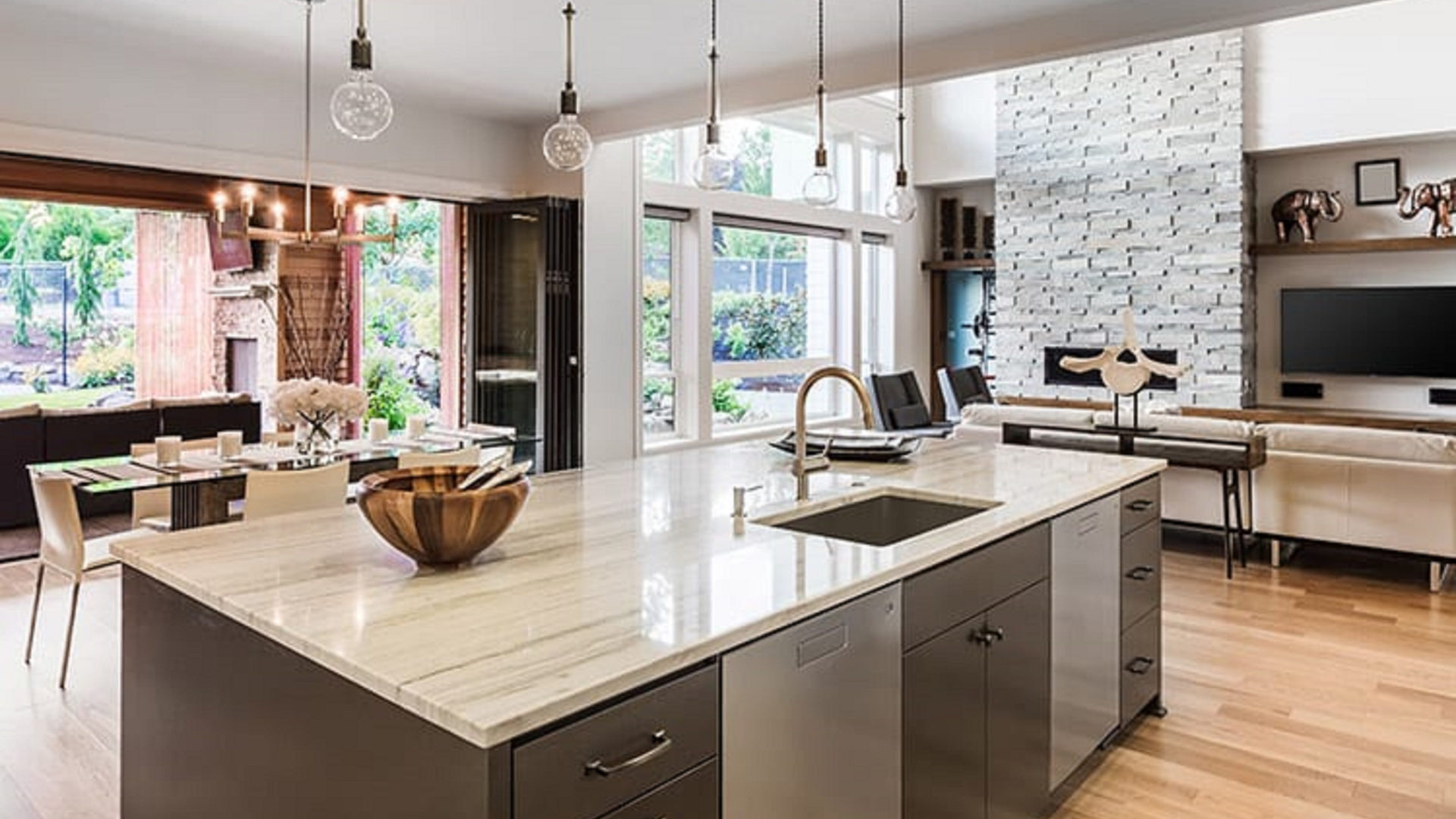 There is a large island in the middle of the kitchen.