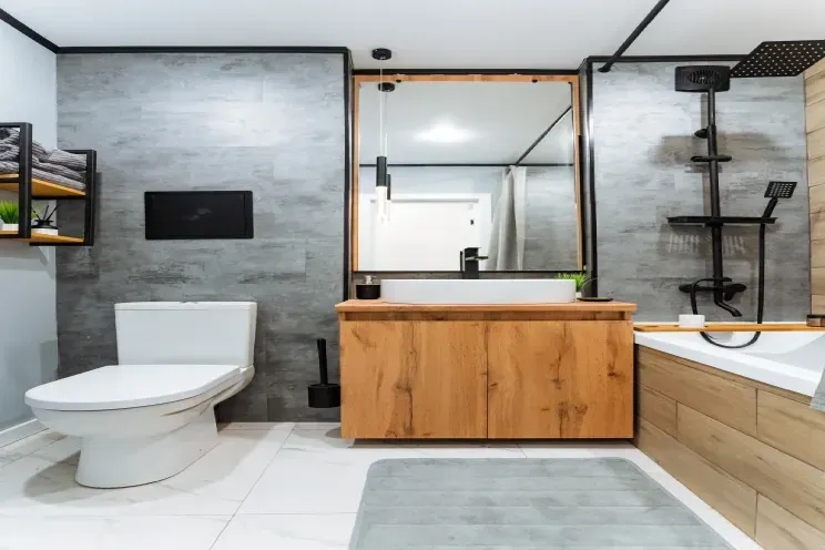 A bathroom with a toilet , sink , and bathtub.