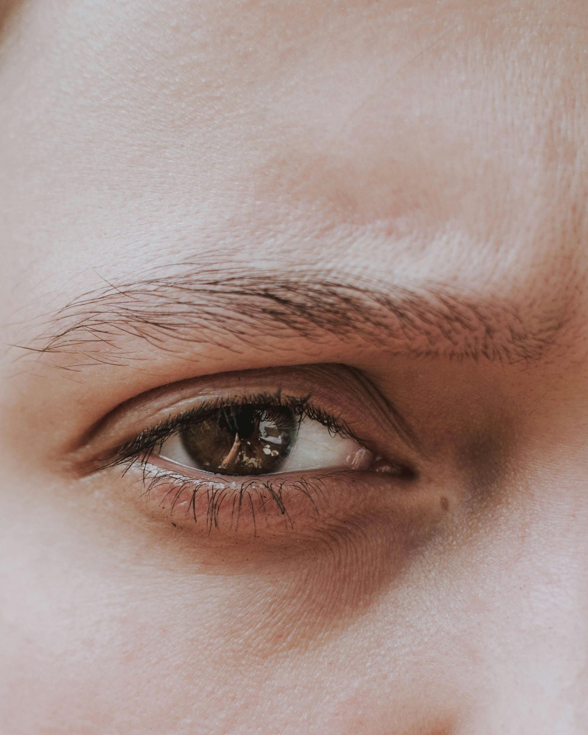 A close up of a woman 's eye with makeup on it.