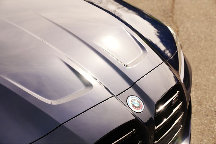 A close up of the hood of a bmw car