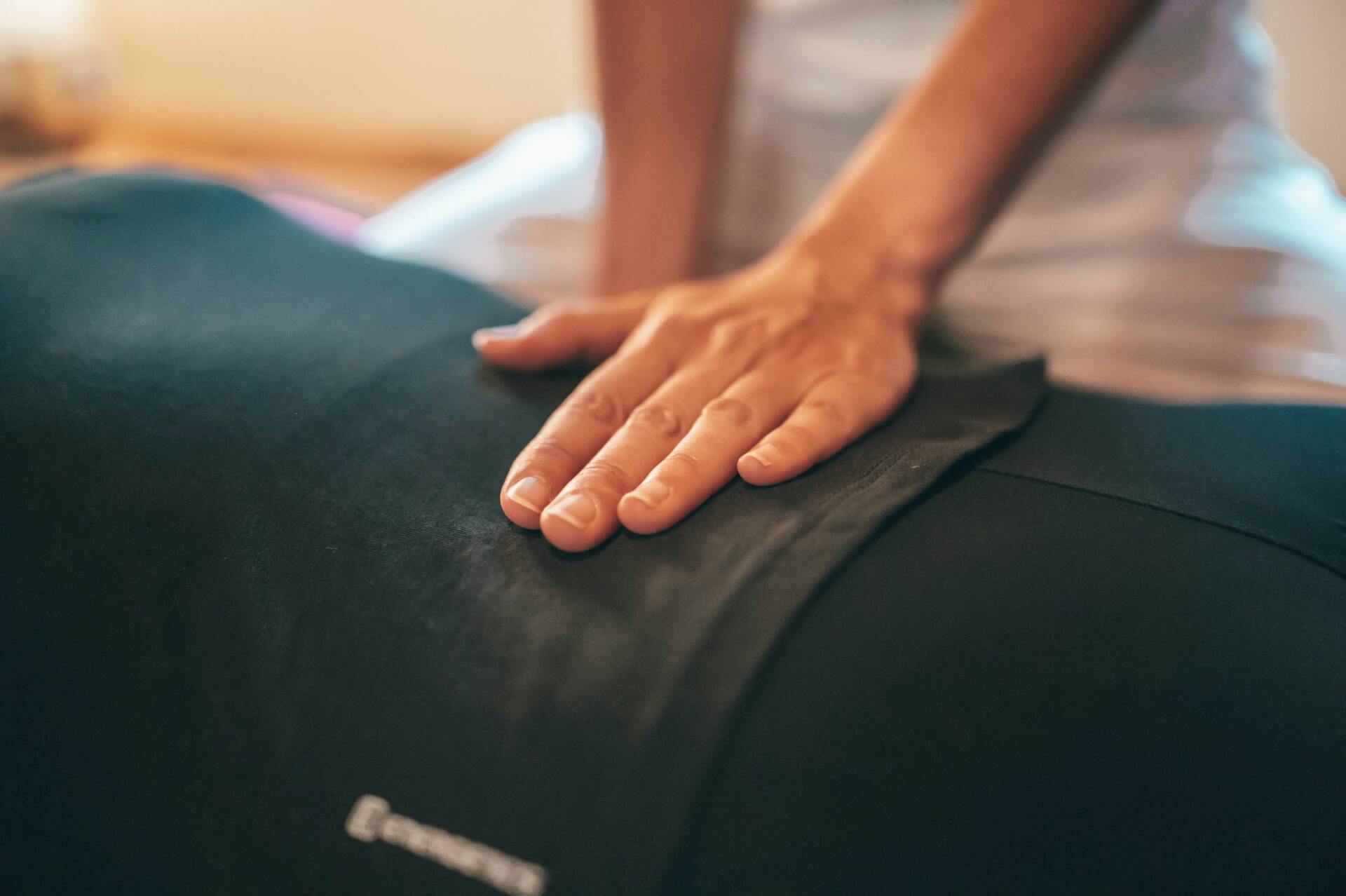 A person is getting a massage on their back.