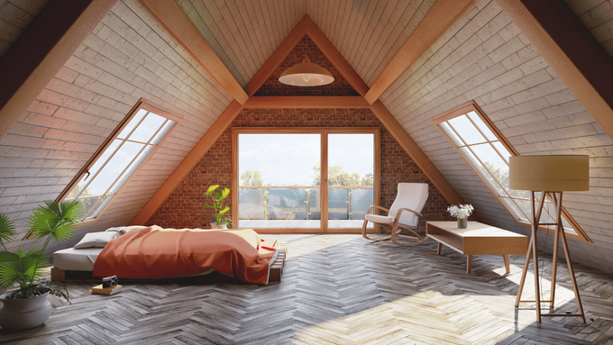 There is a bed in the attic with a lot of windows.