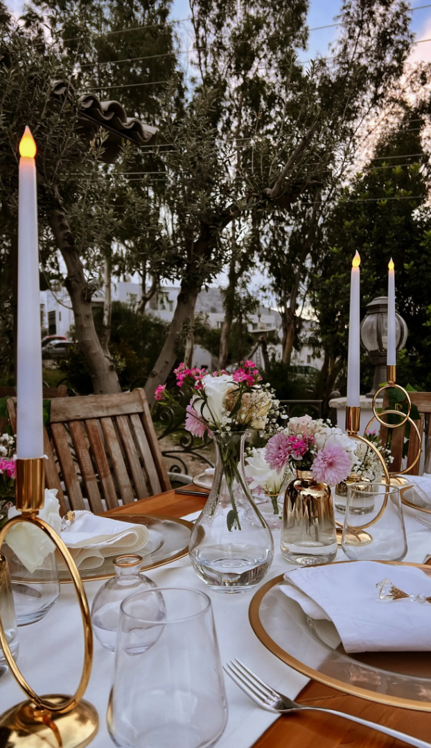 Manzara Boutique Hotel | Elegant outdoor dinner table with white candles, gold glassware