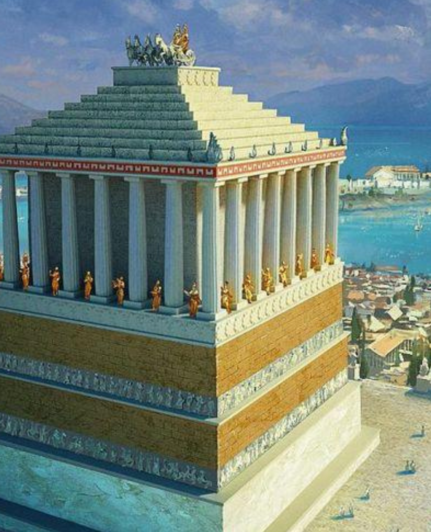 Manzara Boutique Hotel | Ancient stone temple tower with columns, overlooking a coastal city and sea at sunset.