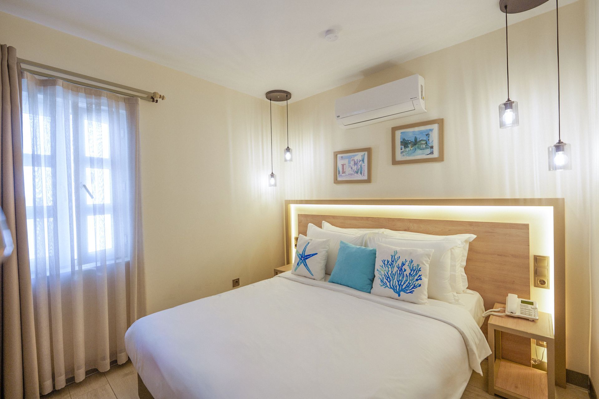 Manzara Boutique Hotel |Junior Suite, Bright beige bedroom with a neatly made white bed, woven headboard, curtains, wall art,
