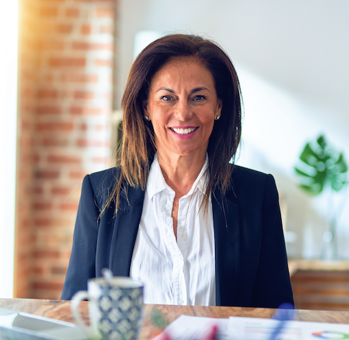 A smiling business woman sitting in her office