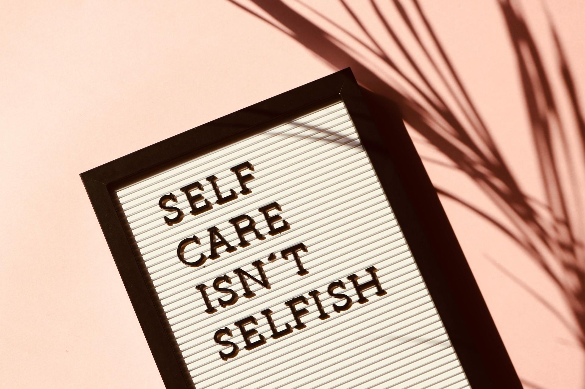 Sign on pink background reads 