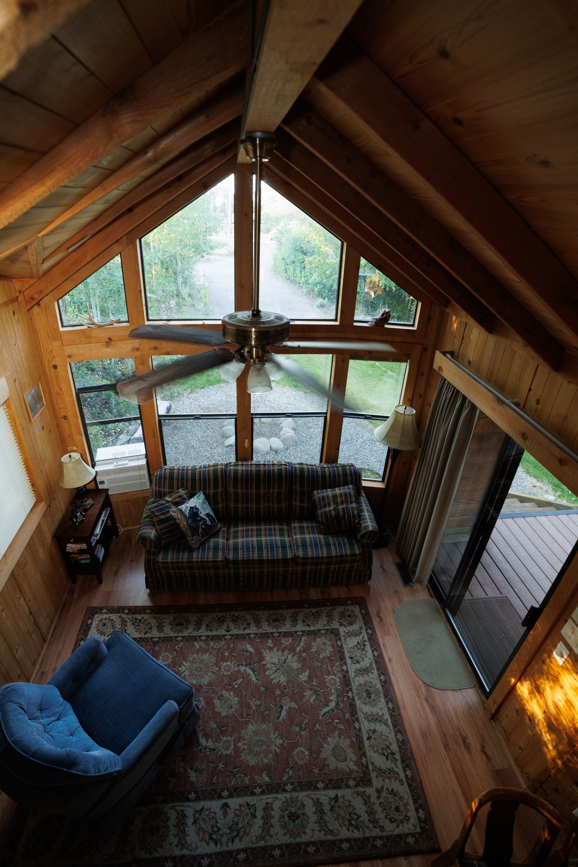 An aerial view of a living room with a couch and chair
