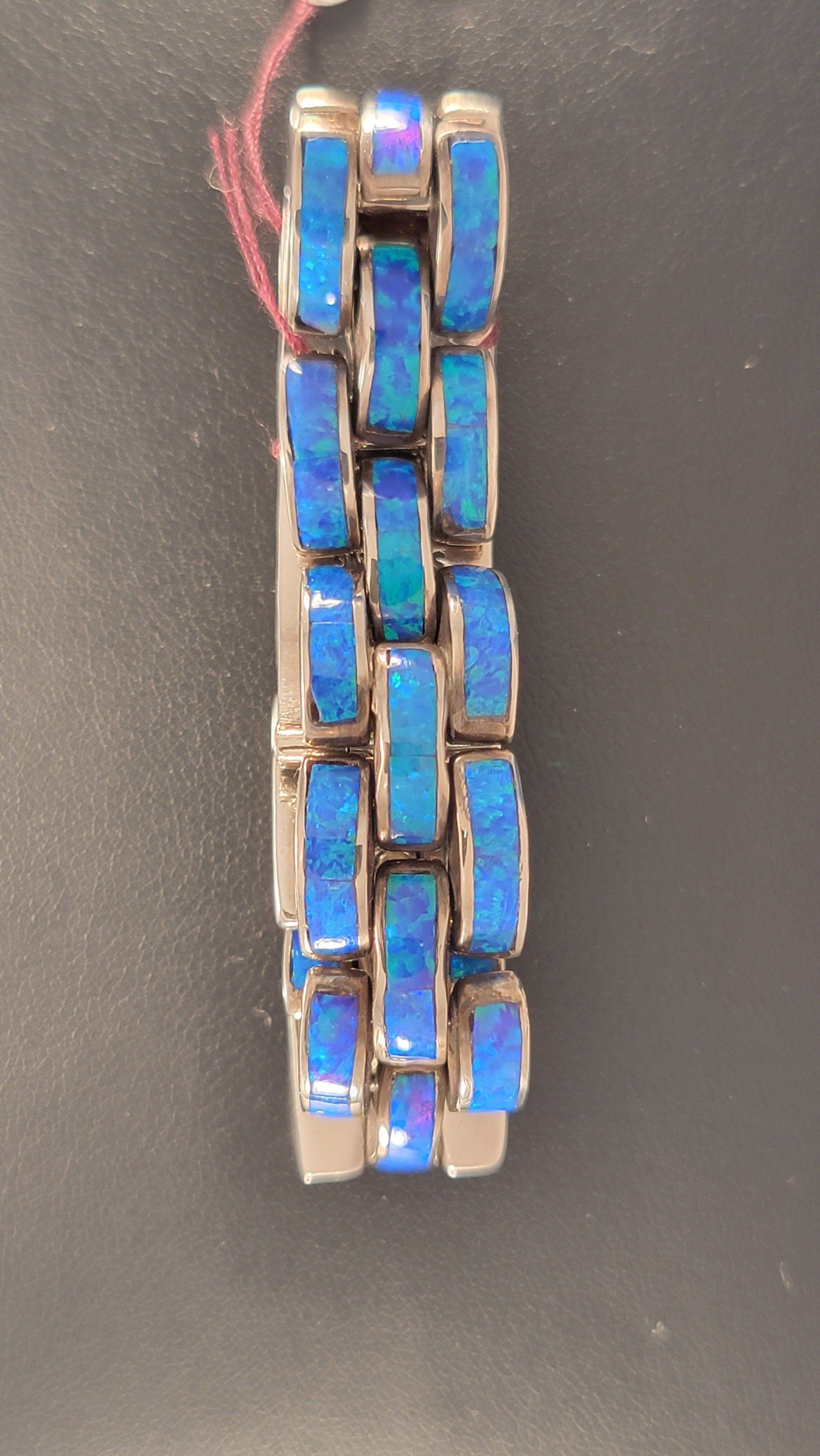 Blue opal link bracelet with silver frames.