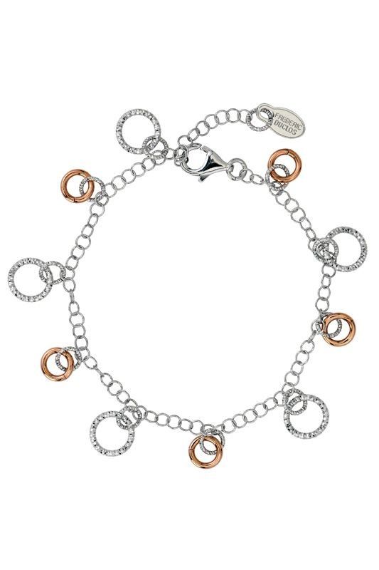 Silver bracelet with textured rings, some in rose gold.