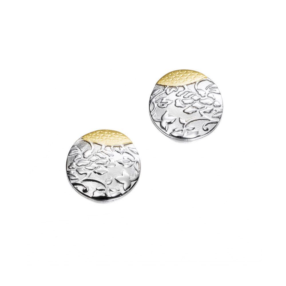 Silver and gold disc earrings with textured surface.