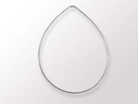 Silver necklace on white background.