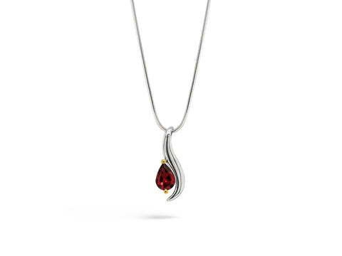 Silver necklace with a pear-shaped red gemstone pendant, set against a white background.