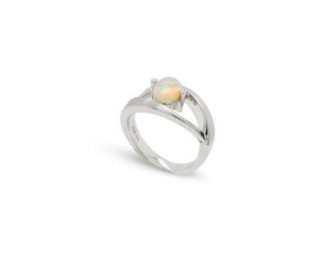 Silver ring with a round, pale opal gemstone.