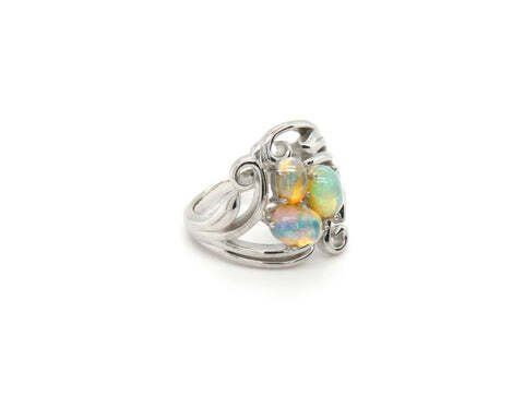 Silver ring with three opals.