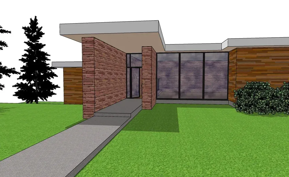 Modern brick house with a front ramp, large windows, and green lawn