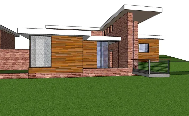 Modern brick and wood house exterior with flat roof and a small front porch, viewed from the side