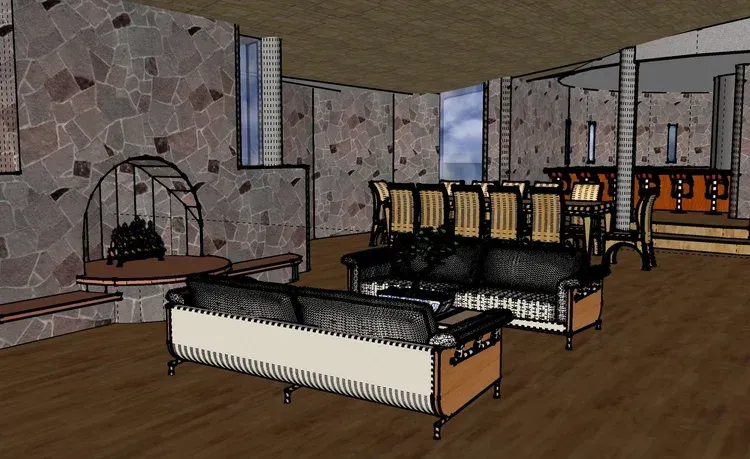 Modern living room with black sofas, white coffee table, stone walls, and wood flooring