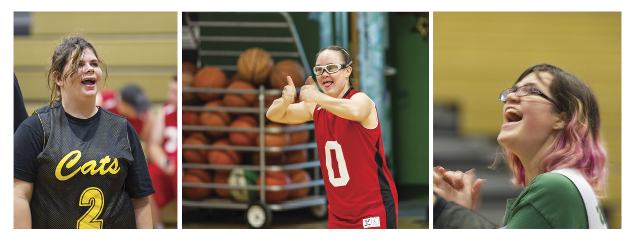 Special Olympics basketball player gives 2 thumbs up with a big smile