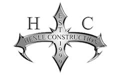 Henle Construction logo with a gray cross and the letters H, C, and EST 1992