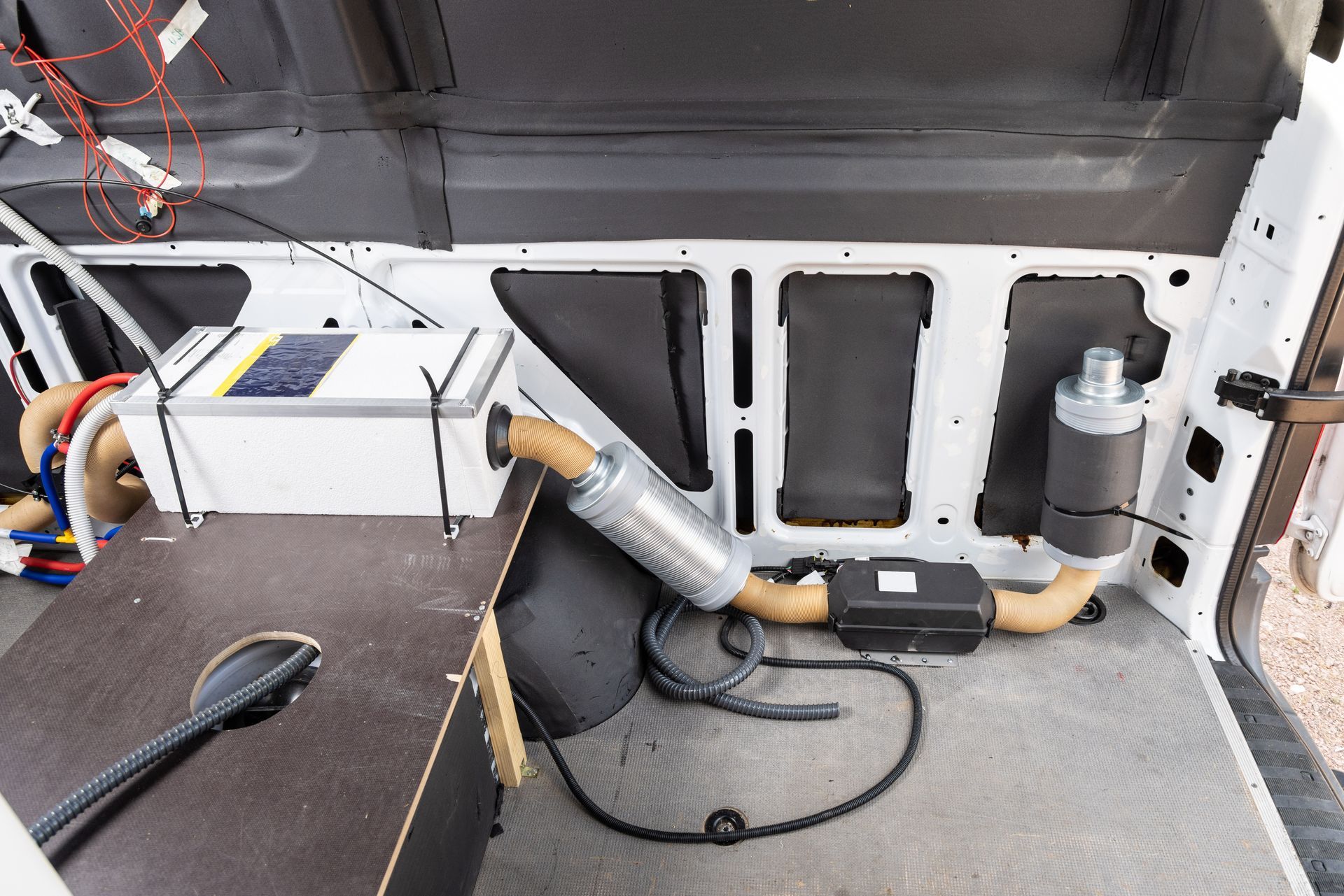 The Inside of a White Van With a Vacuum Cleaner on the Floor — Darwin Caravan & RV Centre In Lee Point, NT