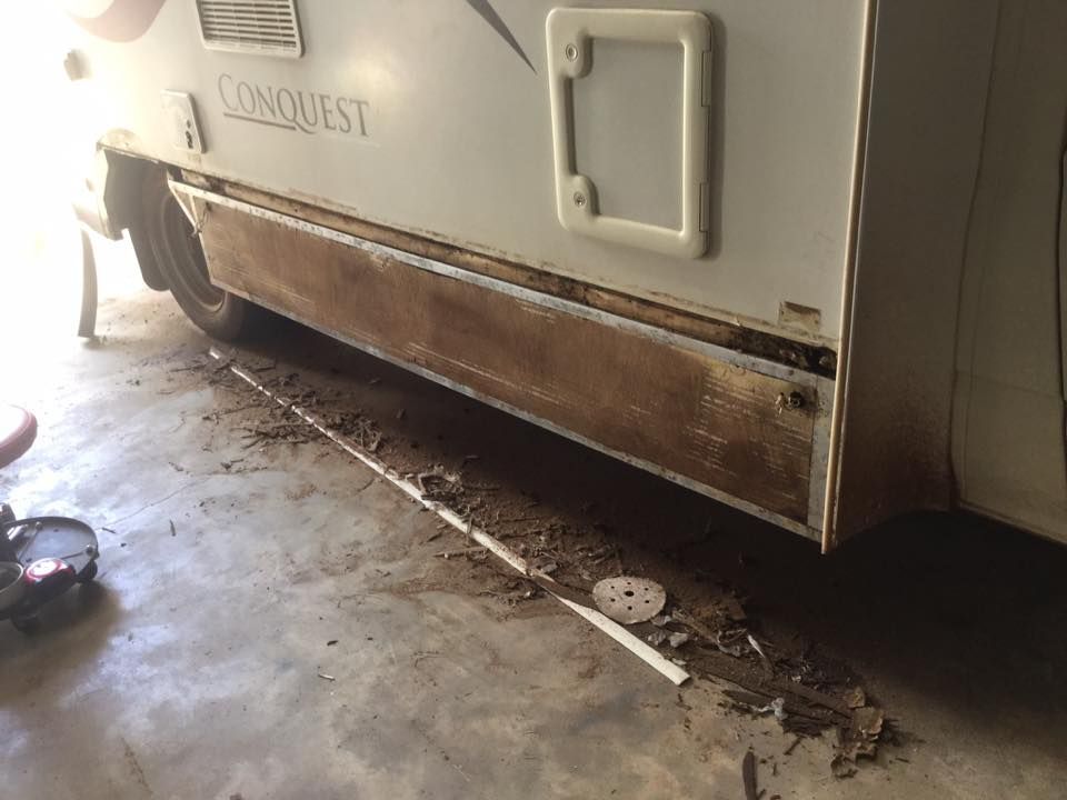 A White RV With the Word Conquest on the Side — Darwin Caravan & RV Centre In Palmerston, NT
