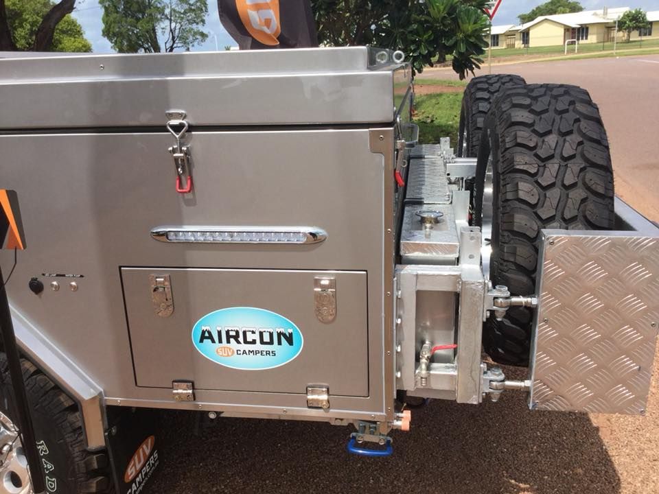 A Silver Aircon Trailer is Parked on the Side of the Road — Darwin Caravan & RV Centre In Berrimah, NT