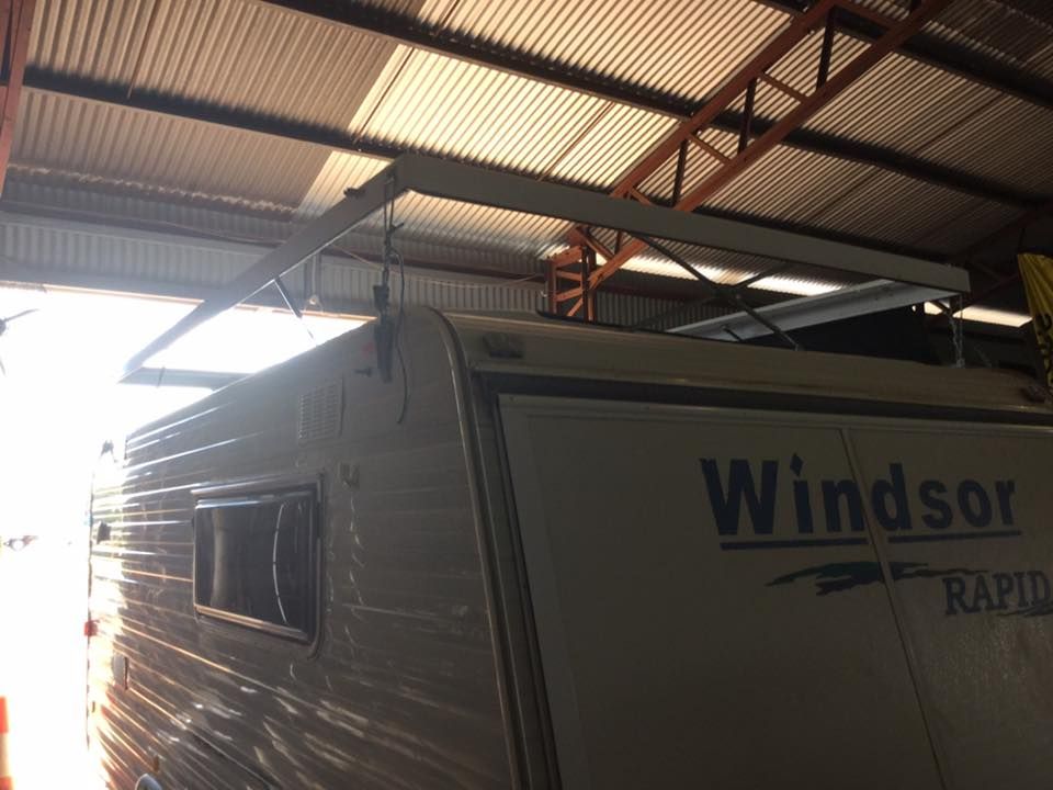 A Windsor RV is Parked in a Garage — Darwin Caravan & RV Centre In Berrimah, NT