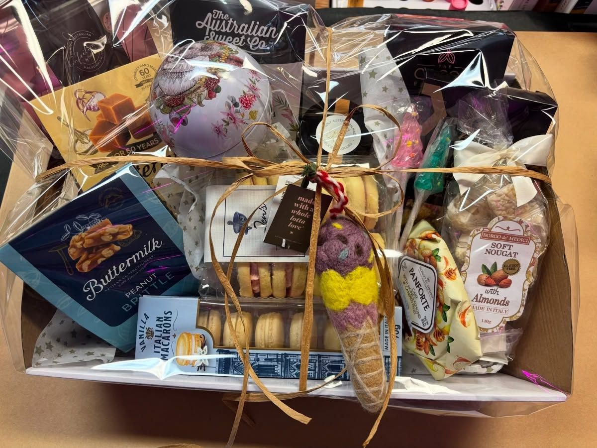 Gift Basket With Various Packaged Treats and a Decorative Ice Cream Cone — Decadence Gifts & Homewares in Springsure, QLD