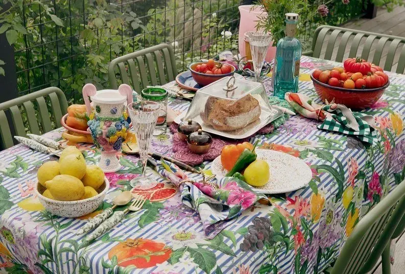 A Colourful Outdoor Table Set for a Meal, With Fruit, Vegetables, and Drinks — Decadence Gifts & Homewares in Springsure, QLD