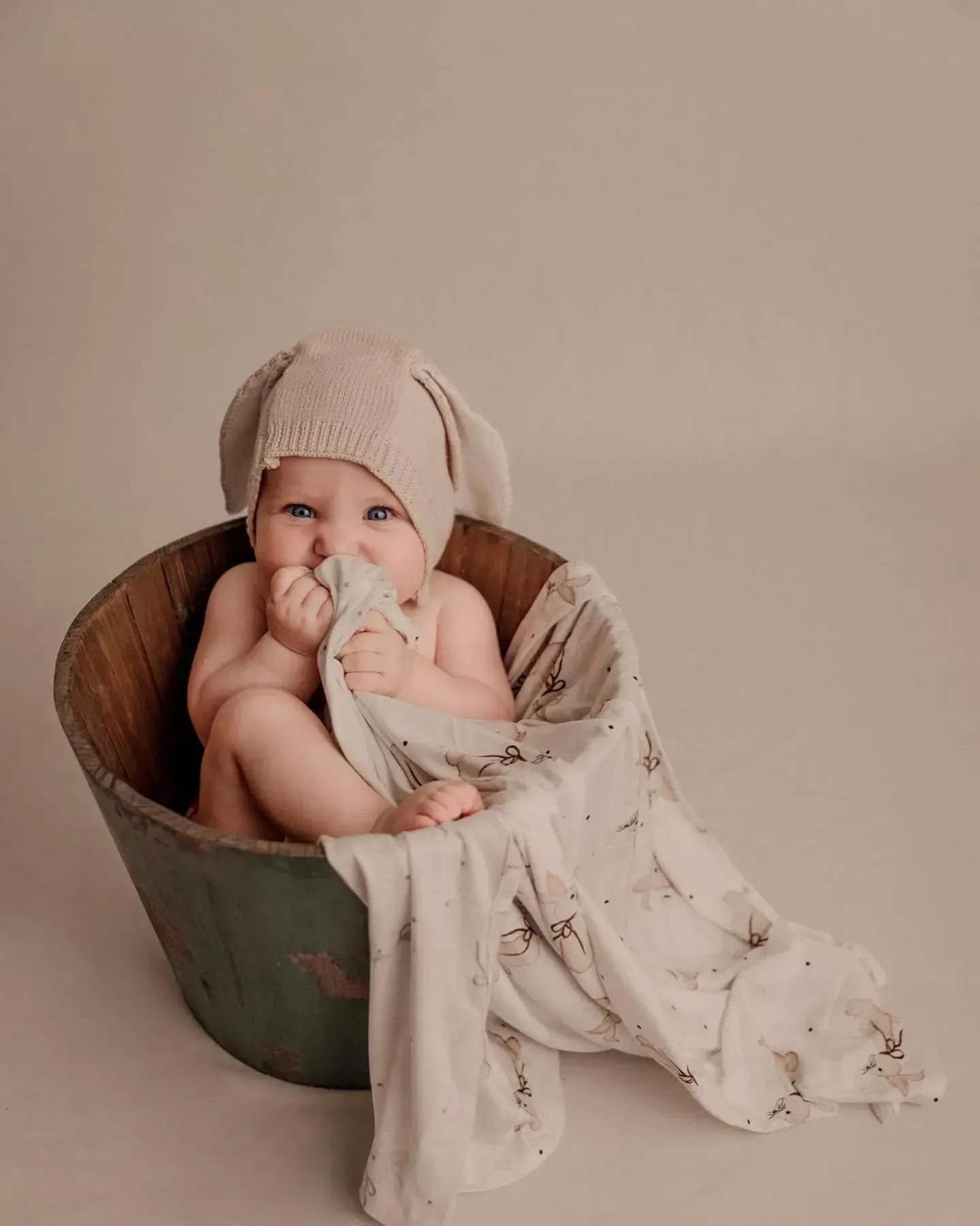 Baby Wearing Bunny Ears, Sitting in a Wooden Tub — Decadence Gifts & Homewares in Springsure, QLD