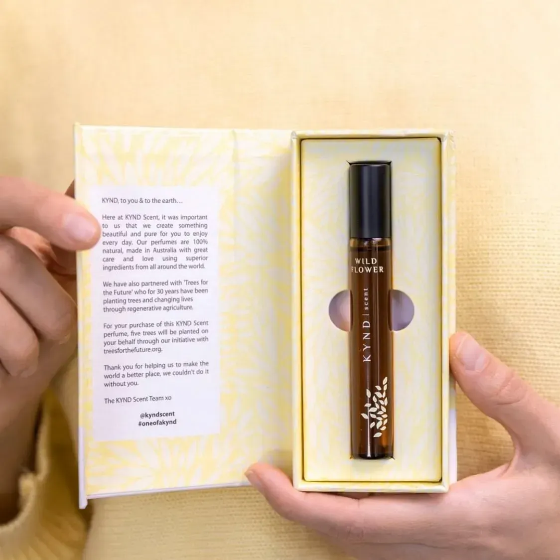 Person Holding Open Perfume Box With a Brown Vial — Decadence Gifts & Homewares in Yeppoon, QLD