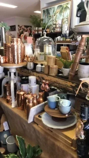 A Shop Display Filled With Copper-coloured Canisters — Decadence Gifts & Homewares in Springsure, QLD